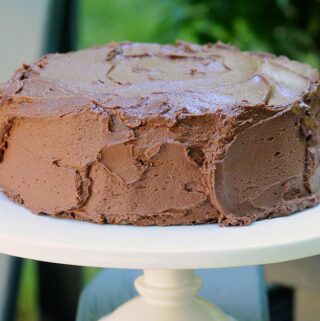 chocolate cake on white cake stand